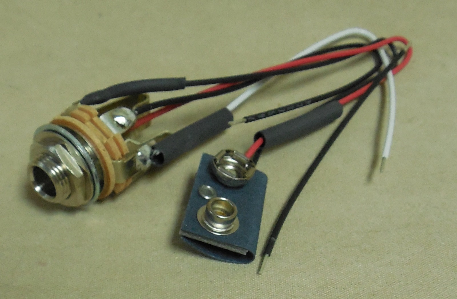 NEW OVERSTOCK EMG BATTERY AND .25 INCH INPUT JACK FOR GUITAR