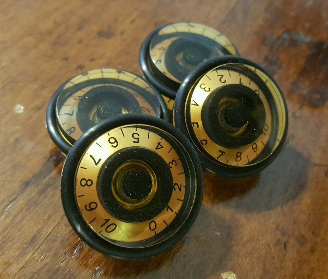4 Guitar Speed Grip Speed Volume/Tone Knobs. Royal Gold/Black w/ Gold Flake. JAT